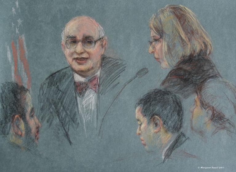 Dr. Marc Sageman, center, a terrorism consultant and former CIA case agent, testifies as defense attorney Janice Bassil, right, asks questions. Defendant Tarek Mehanna is at left. Other attorneys are at right. (Margaret Small for WBUR)