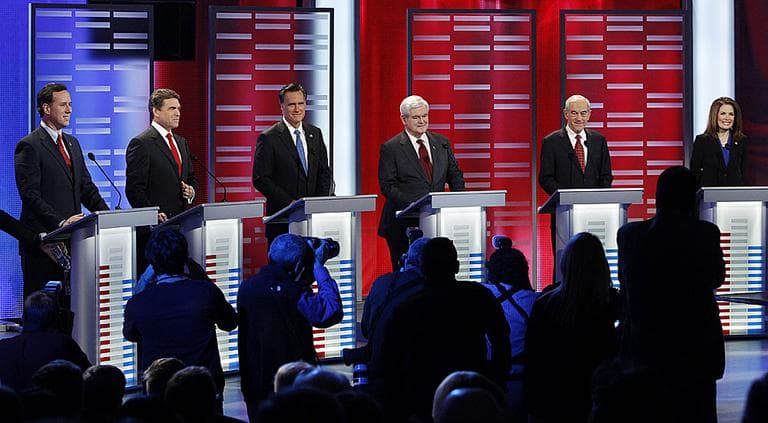 Republican presidential candidates take their place for a Republican debate on Saturday, Dec. 10, in Des Moines, Iowa. (AP Photo/Eric Gay)