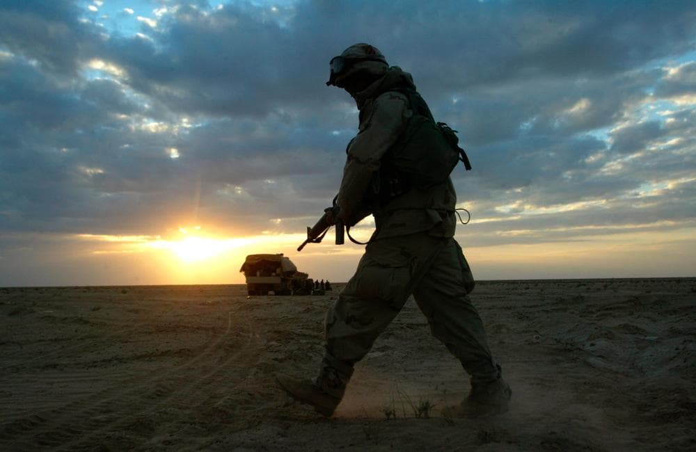 A soldier with A Company 3rd Battalion 7th Infantry Regiment, part of the 3rd Infantry Division, walks through the desert near Karbala in central Iraq in 2003. (AP)