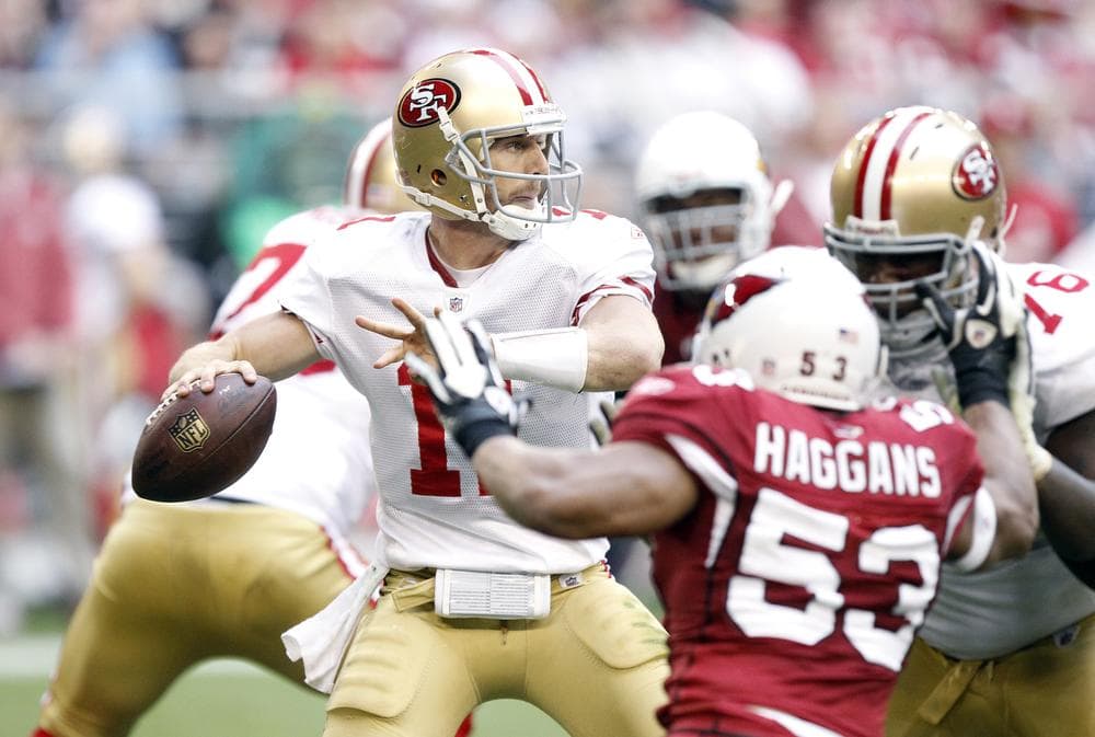 San Francisco 49ers' Alex Smith attempts to complete a pass against the Arizona Cardinals on Sunday in Glendale, Ariz. The 49ers gave up a 12-point lead, losing the game 21-19. (AP)