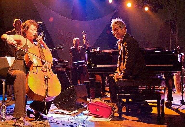 Pink Martini's Thomas Lauderdale, right, and Pansy Chang, left, during a 2008 performance. (Guillaume Laurent/Flickr)