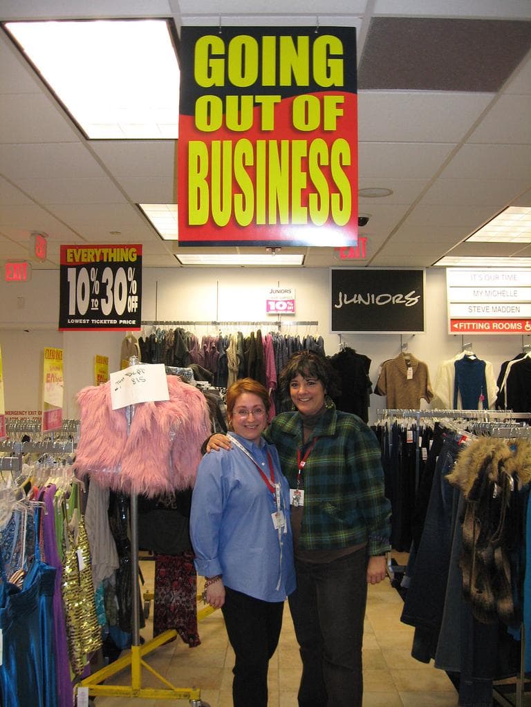 Longtime Filene's Basement employees Lori Frongillo (right) and Tracy Ruiz at the Back Bay store during its &quot;Going Out of Business&quot; sale (Sacha Pfeiffer/WBUR)