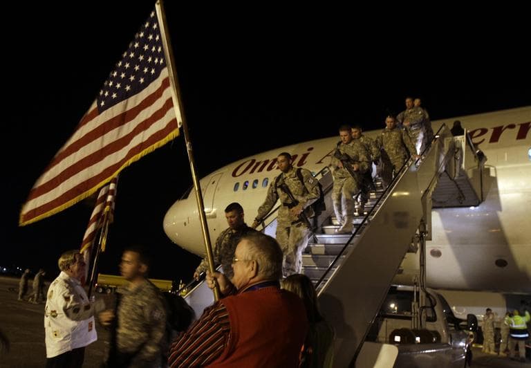 In this Dec. 3, 2010 photo, volunteers welcome home members of 1st Brigade, 3rd Infantry Division. (AP)