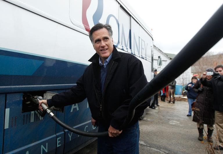 Republican presidential candidate and former Massachusetts Gov. Mitt Romney pumps diesel into his bus during a campaign stop in Randolph, N.H., Thursday. (AP)