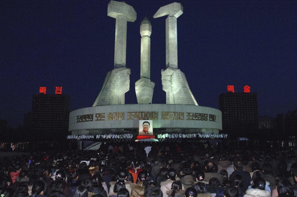 North Koreans gather to pay respects to their late leader Kim Jong Il in front of a monument to mark the founding of Workers' Party in Pyongyang, North Korea. (AP) 