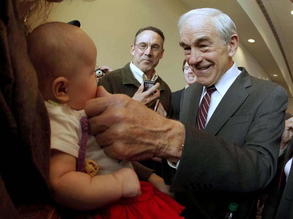 Republican presidential candidate, Rep. Ron Paul, R-Texas greets 3-month-old Heidi Lange during a campaign stop in Dubuque, Iowa, Thursday. (AP)