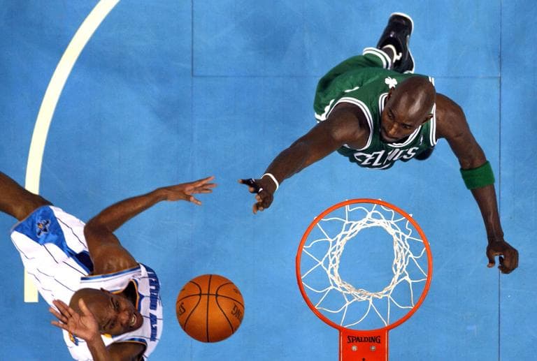 New Orleans Hornets point guard Jarrett Jack drives to the basket against Boston Celtics power forward Kevin Garnett Wednesday night. (AP)