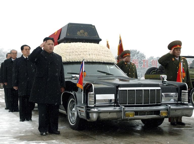 North Korea&#039;s next leader, Kim Jong Un, front left, salutes beside the hearse carrying the body of his late father and North Korean leader Kim Jong Il during the funeral procession in Pyongyang, North Korea. (AP)