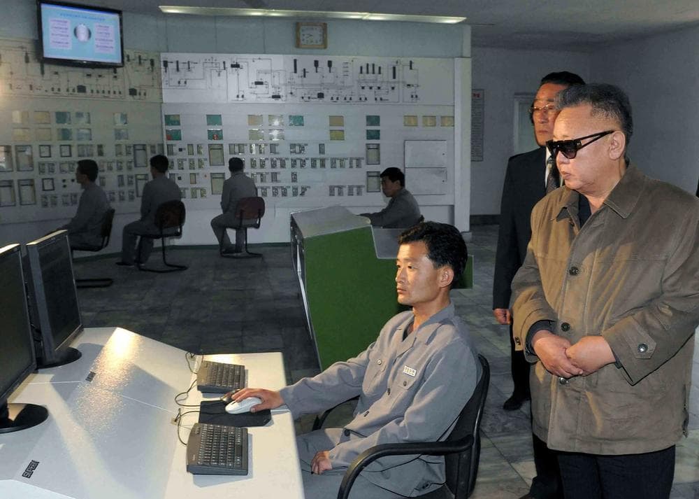 In this undated photo released by Korean Central News Agency via Korea News Service in Tokyo Sunday, May 8, 2011, North Korean leader Kim Jong Il, wearing glasses, visits the Namhung youth chemical complex in Anju, North Korea. (AP)