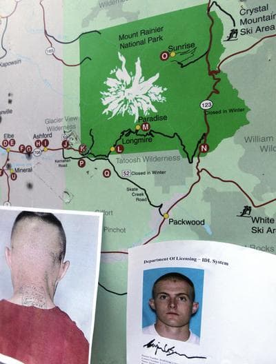 Photos provided by the Pierce County Sheriff&#039;s Dept. of Benjamin Colton Barnes, are taped to a map of the Mount Rainier area, at Mount Rainier National Park, Sunday, Jan. 1, 2012 in Washington State. (AP)