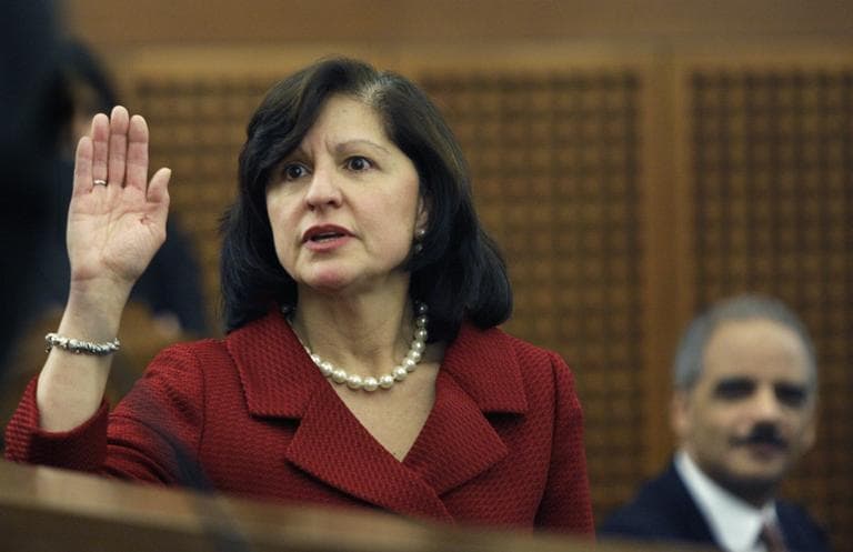 U.S. Attorney General Eric Holder, right, watches as the new U.S. Attorney for Massachusetts Carmen Ortiz is sworn in during her installation ceremony at the federal courthouse in Boston Monday, Jan. 11, 2010. (AP)