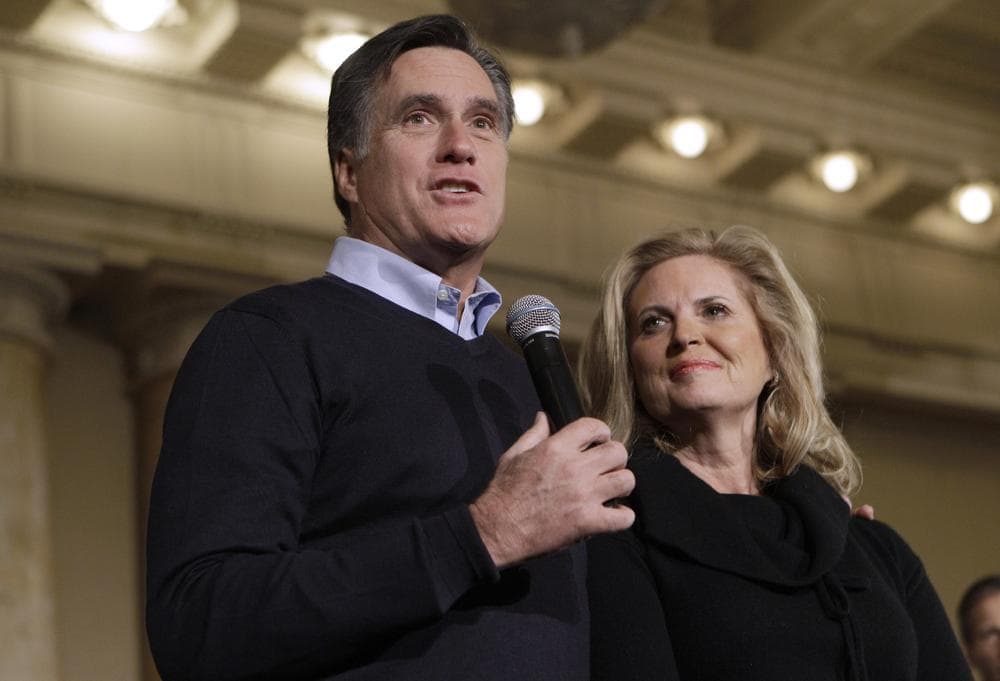 Republican presidential candidate, former Massachusetts Gov. Mitt Romney, accompanied by his wife Ann, speaks during a caucus day rally at the Temple for Performing Arts, in Des Moines, Iowa. (AP)