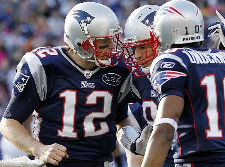 Tom Brady celebrates a touchdown by tight end Aaron Hernandez during the second quarter of an NFL game against the Buffalo Bills. (AP Photo/Elise Amendola) 