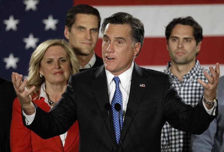 Republican presidential candidate, former Massachusetts Gov. Mitt Romney address supporters with his family behind him during a Romney for President Iowa Caucus night rally in Des Moines, Iowa, Thursday, Jan. 3, 2012. (AP Photo/Charlie Neibergall)