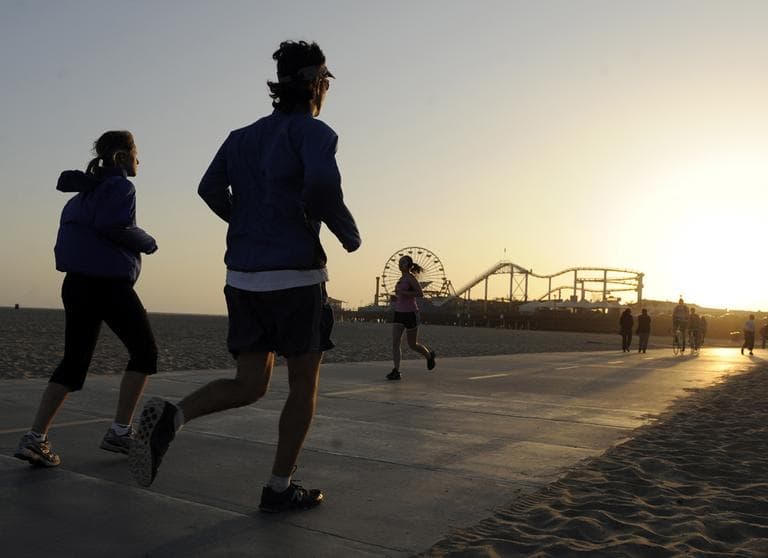 In this May 23, 2011 photo, joggers make their way down Santa Monica Bike Path, in Santa Monica, Calif. Despite all the “Biggest Loser” type shows, all the pounds shed on those shows and all the weight-loss products purchased by viewers at home, America continues to be the Biggest Gainer. (AP)