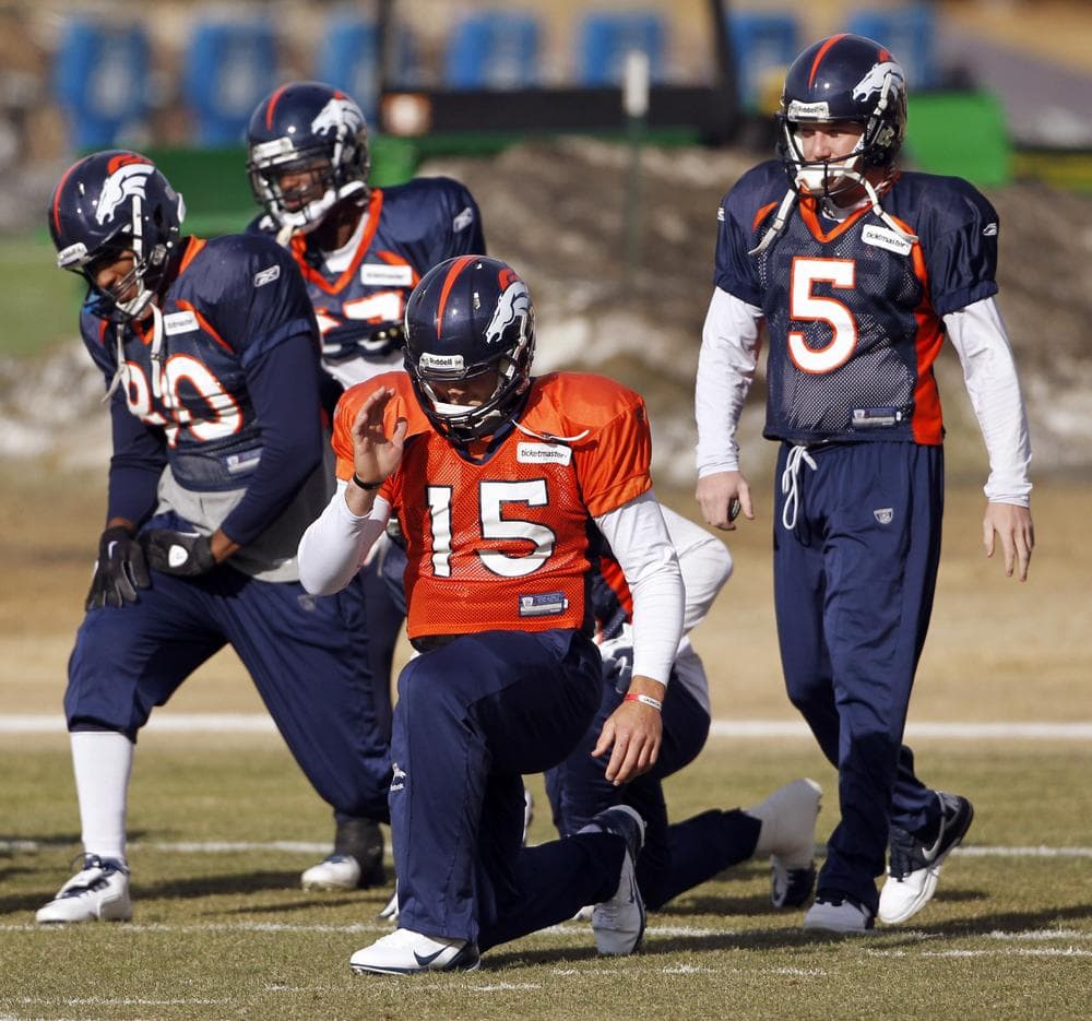Denver Broncos quarterback Tim Tebow (15) stretches with teammates during NFL football practice in Englewood, Colo., on Wednesday. The Broncos are scheduled to host the Pittsburgh Steelers on Sunday in a wild-card playoff game. (AP)