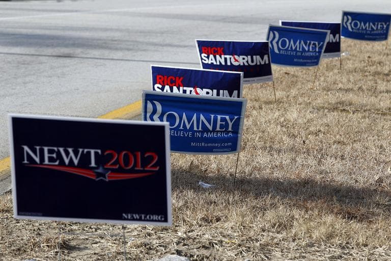Signs from various candidates are seen planted on a grass covered median on Thursday  in Manchester, N.H..