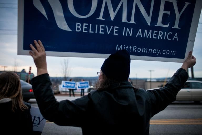 A standout outside Mitt Romney’s campaign headquarters in Manchester, N.H., Saturday (Dominick Reuter for WBUR)