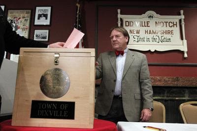 A voter casts his early morning ballot in Dixville Notch, N.H. (AP)