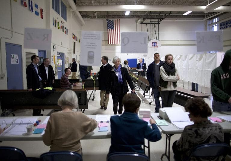 Voters arrive to cast ballots at the Webster School in Manchester, N.H. on Tuesday. (AP)