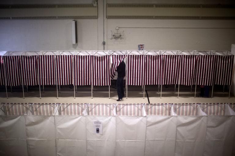 Voters cast ballots in the gym of the Webster School in Manchester, N.H., on Tuesday. (AP)