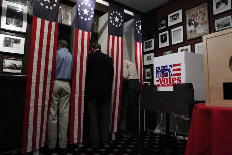 Residents get ready to mark their ballots in Dixville, N.H late Monday night. (AP)