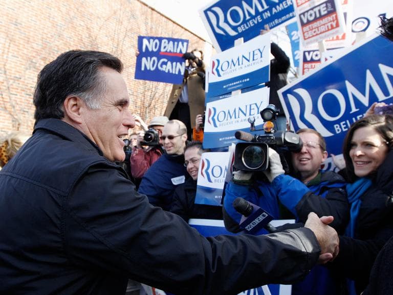 Mitt Romney visits a polling station in Manchester, N.H., Tuesday. (AP)