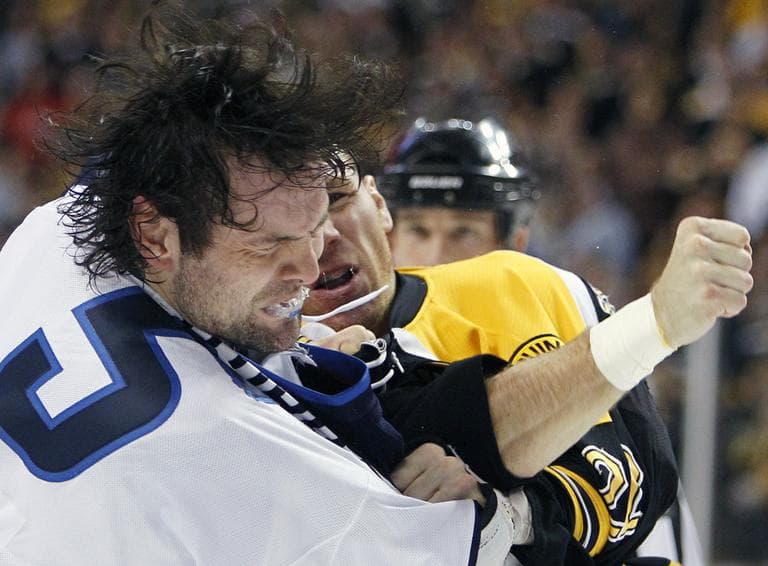 Boston Bruins&#039; Shawn Thornton, rear, lands a punch on Winnipeg Jets&#039; Mark Stuart (5) in the second period of an NHL hockey game in Boston, Tuesday. (AP)