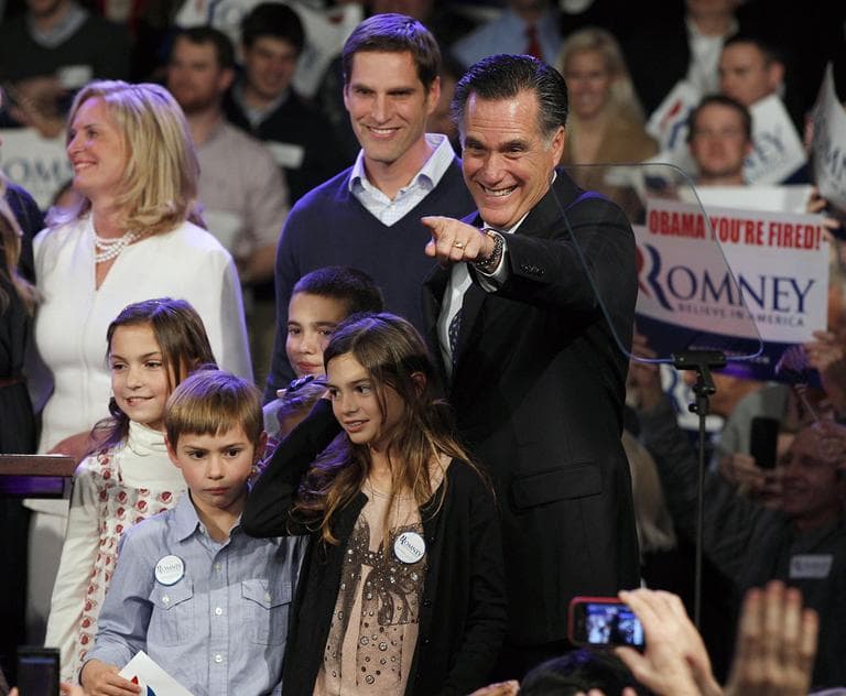 Former Massachusetts Gov. Mitt Romney surrounded by his family points towards supporters at the Romney for President New Hampshire primary night victory party at Southern New Hampshire University in Manchester, N.H., Tuesday, Jan. 10, 2012. (AP)