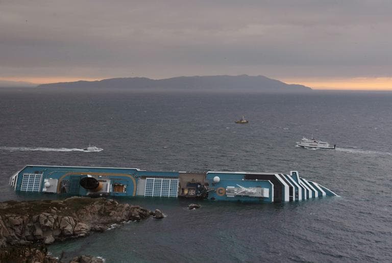 The Costa Concordia cruise liner lies on its side two days after it ran aground off the tiny Tuscan island of Giglio, Italy, Monday, Jan. 16. (AP)