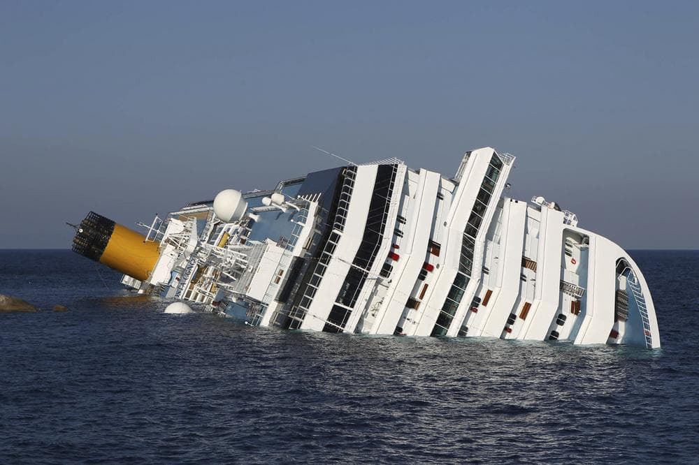 The cruise ship Costa Concordia lays on its side off the tiny Tuscan island of Giglio, Italy, on Jan. 18, 2012. (Andrea Sinibaldi, Lapresse via AP)