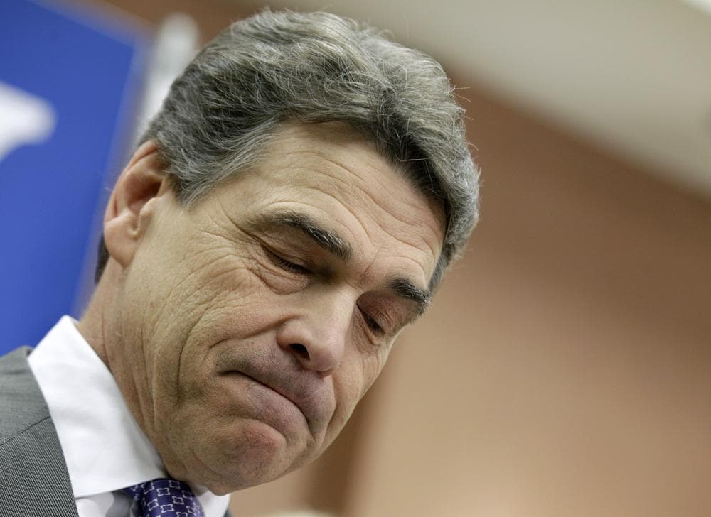Republican presidential candidate, Texas Gov. Rick Perry pauses while announcing he is suspending his campaign and endorsing Newt Gingrich, Thursday. (AP)