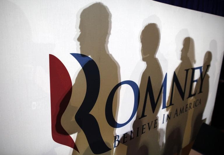 Shadows of audience members are cast on a campaign sign in Irmo, S.C., Wednesday. (AP)