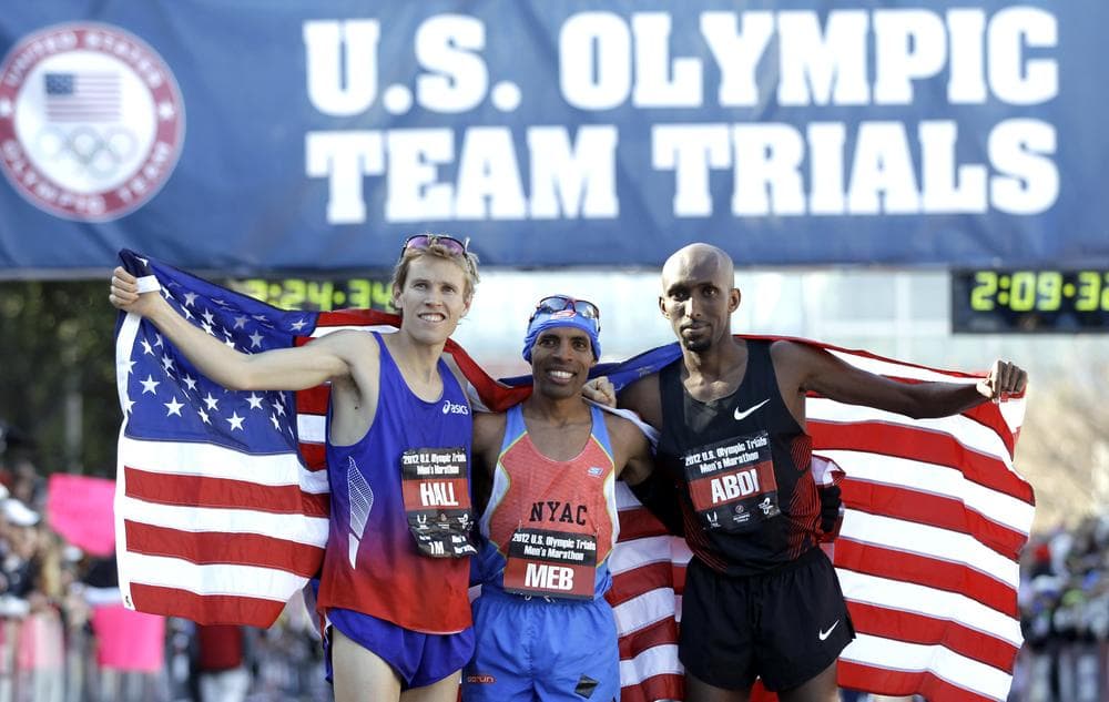 Ryan Hall, Meb Keflezighi, and Abdi Abdirahman celebrate after qualifying for the U.S. Olympic marathon team in Houston. (AP)