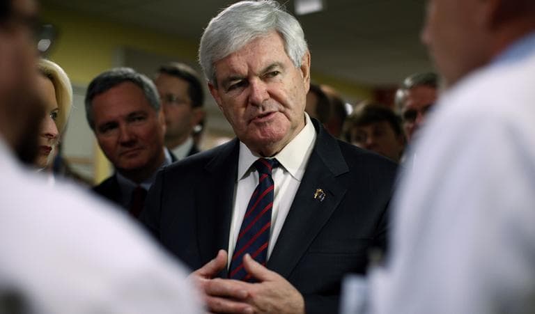 Republican presidential candidate, former House Speaker Newt Gingrich listens to staff during visit to Children's Hospital, Friday, Jan. 20, 2012, in Charleston, S.C. (AP)