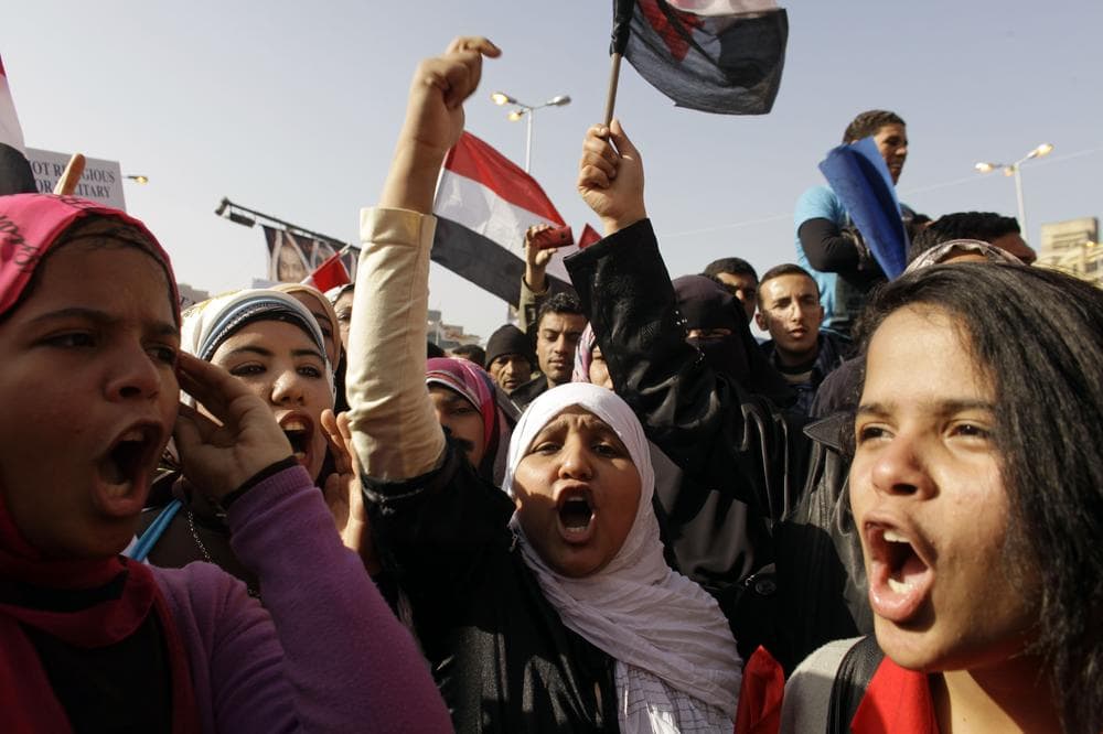 Egyptian girls chant slogans in Tahrir Square during a rally to mark the one year anniversary of the uprising that ousted President Hosni Mubarak in Cairo, Egypt. (AP)