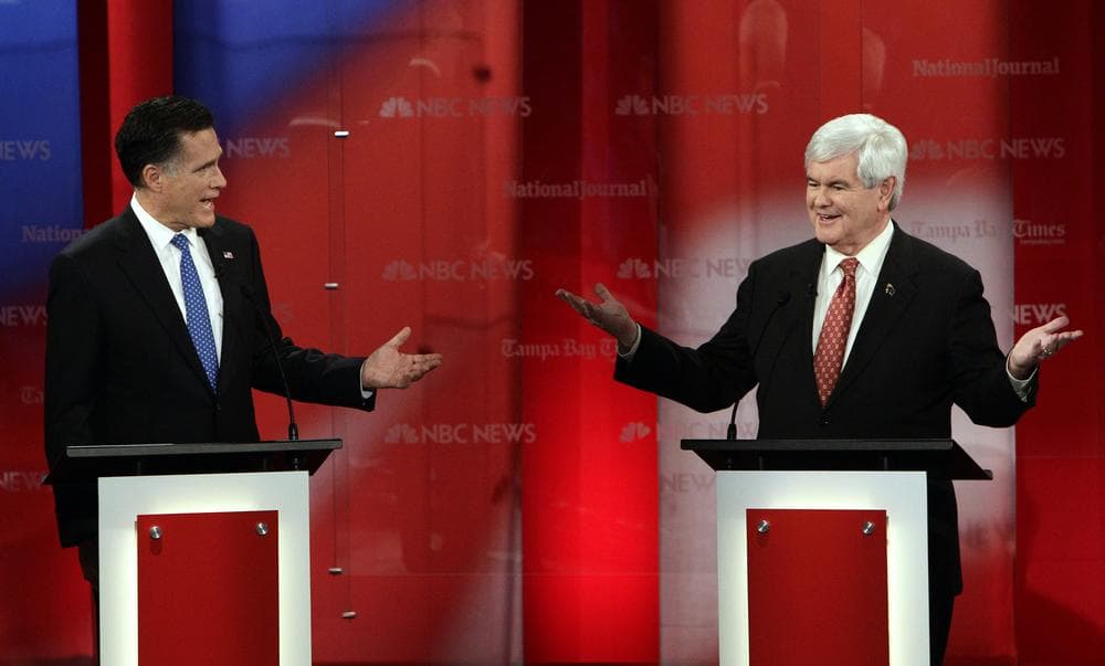 Republican presidential candidates former Massachusetts Gov. Mitt Romney, left, and former House Speaker Newt Gingrich gesture during a Republican presidential debate Monday in Florida. (AP)