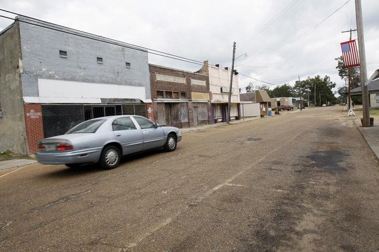 In this Oct 19, 2011 file photo, an automobile rolls past many closed storefront businesses in downtown Pickens, Miss. The ranks of America's poor have climbed to a record high, according to new census data that paints a stark portrait of the nation's haves and have-nots at a time when unemployment remains persistently high. (AP)