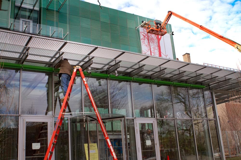 The facade of the museum's new building is worked on. (Jesse Costa/WBUR)