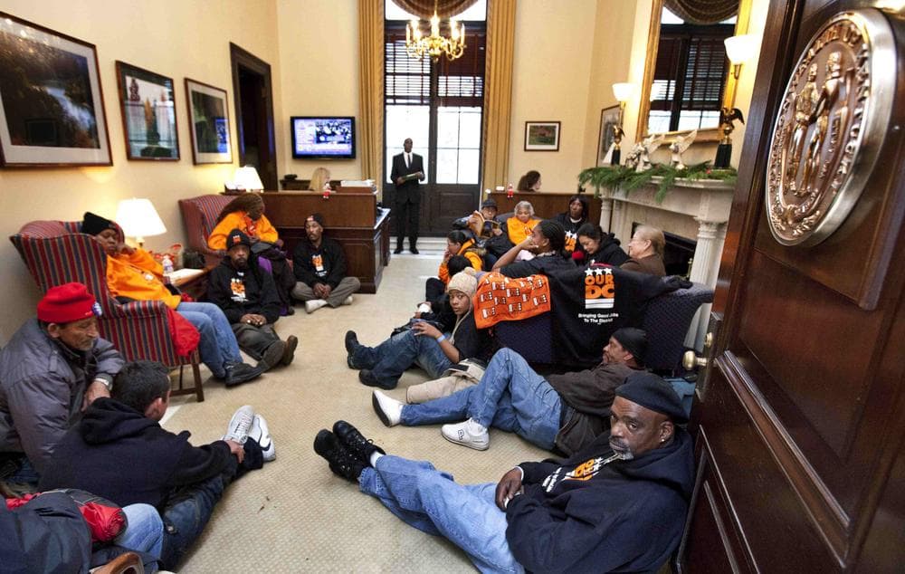 A protest inside the office of Senate Minority Leader Mitch McConnell of Ky., Tuesday, Dec. 6, 2011, on Capitol Hill in Washington. Protesters are demanding that the lawmakers represent the &quot;99 percent&quot; and not just the corporate lobbyist and and the richest. (AP)