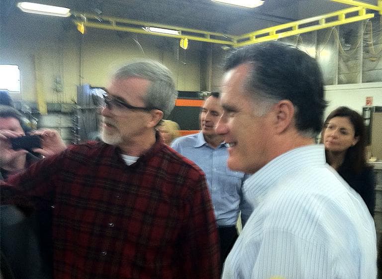 Mitt Romney tours a metal fabricating facility in Hudson, N.H., Monday (Deborah Becker/WBUR)