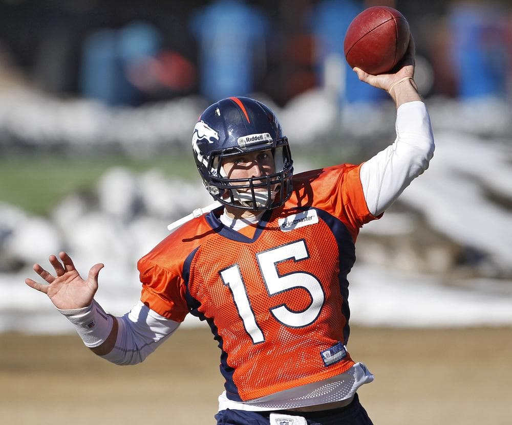 Tim Tebow throws a pass during practice at the football team&#039;s training facility in Englewood, Colo., on Tuesday. (AP)