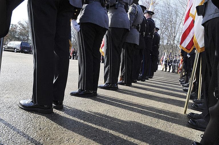 In Massachusetts, debate over so-called three strikes legislation was prompted by the fatal shooting of Woburn  police officer John Maguire. Above, Maguire being laid to rest in 2010. (AP)