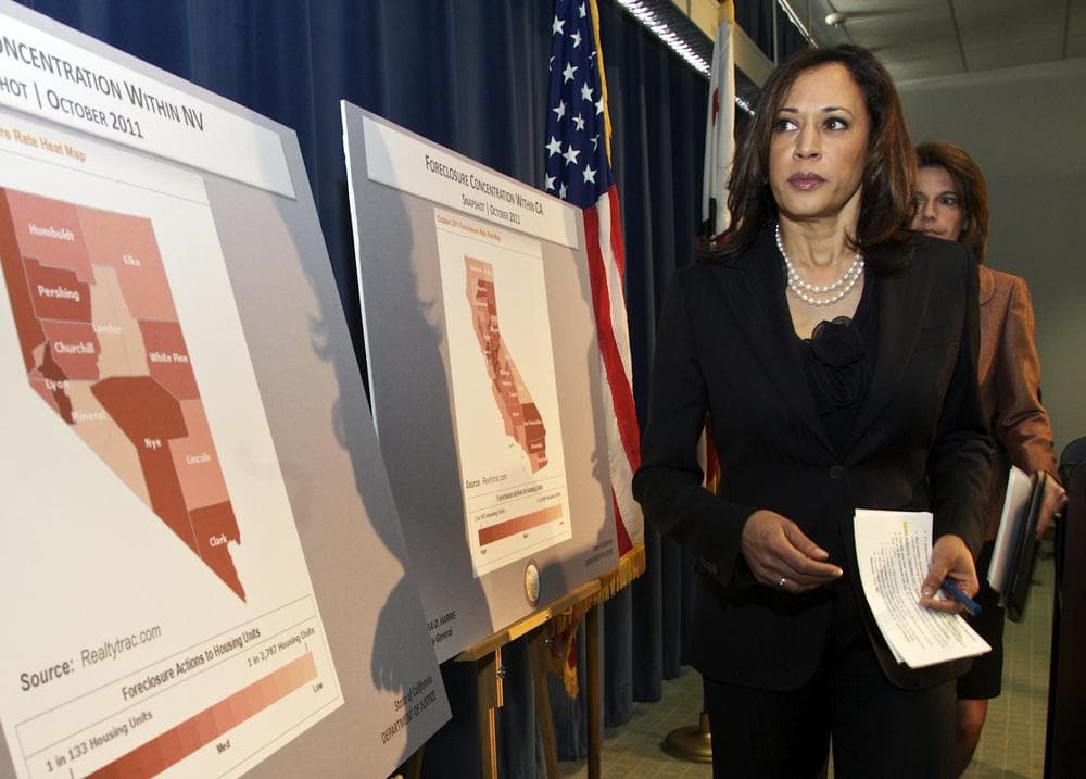 Attorneys General Kamala D. Harris of California, left, and Catherine Cortez Masto of Nevada walk past foreclosure charts of their states. (AP)