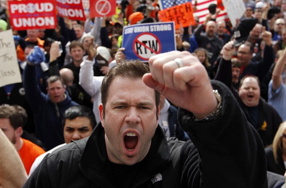Rob Parsons, a steelworker from Merrillville, Ind., screams during a union workers protest on the steps of the Statehouse after the Senate voted to pass the right-to-work bill in Indianapolis, Wednesday, Feb. 1, 2012. The governor is expected to sign the bill later in the day. (AP Photo/Michael Conroy)