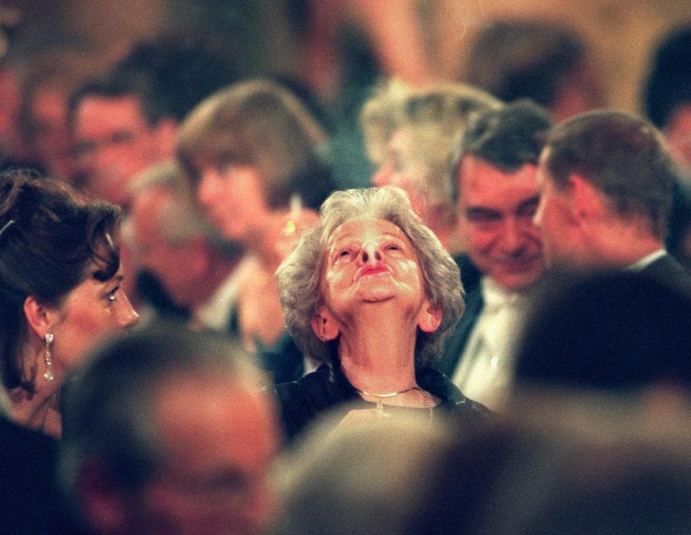 Polish poet and Nobel laureate Wislawa Szymborska puffs out a cloud of cigarrette smoke, sitting among other, unidentified, guests at the Nobel banquet at the Town Hall of Stockholm, Sweden, Tuesday December 10 1996. Earlier that day Wislawa Szymborska received the Nobel Prize in literature for her &quot;beautiful, deep and subtle poetry&quot;.(AP)