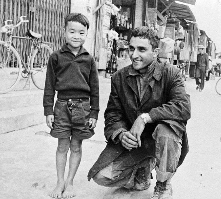 In this Jan. 1, 1966 file photo, AP special correspondent George Esper poses with a Vietnamese boy in Quang Ngai Province, south of Da Nang. (AP)