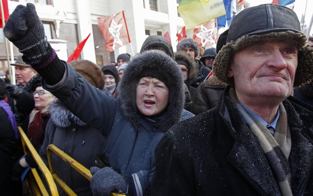 Communist party supporters shout anti government slogans during a rally protesting alleged vote rigging in Russia&#039;s elections after they visited the mausoleum of Lenin to mark the 88th anniversary of his death at Moscow&#039;s Red Square, Russia, Saturday, Jan. 21, 2012. (AP)