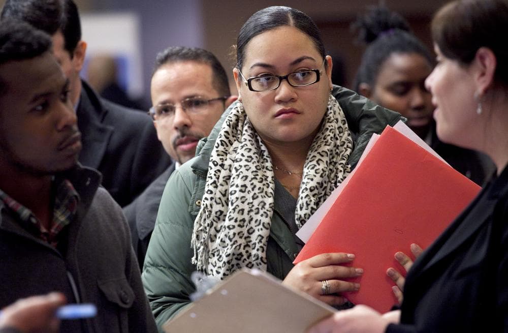 People wait to talk with potential employers at a job fair in New York. (AP)