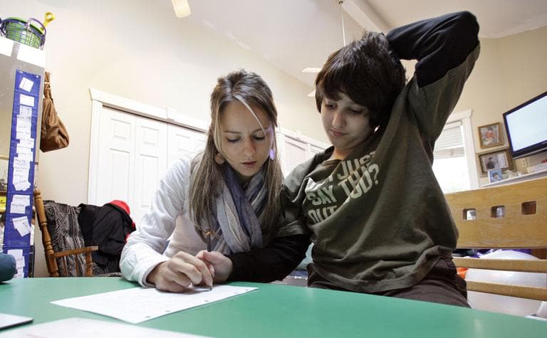Shayan Forough  goes through Applied Behavior Analysis therapy with his  instructor in Oct. 2008. (AP)